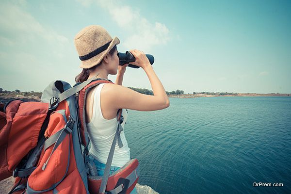 With binoculars