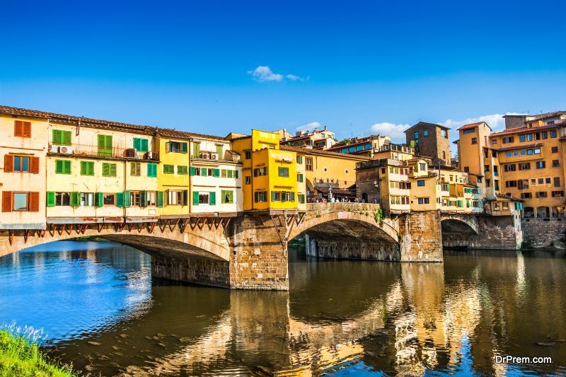 Famous Ponte Vecchio with river Arno at sunset in Florence, Italy